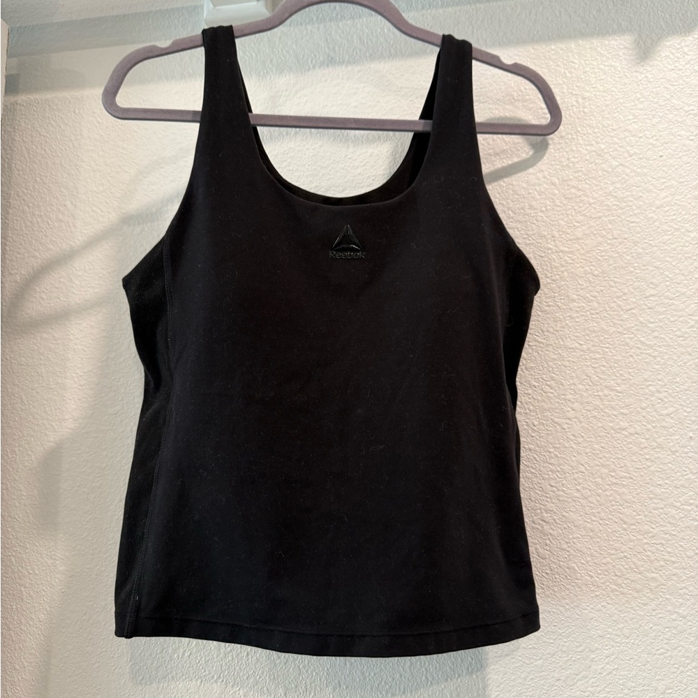 Reebok tank top, cropped and with support cups and shelf. Gently used condition.